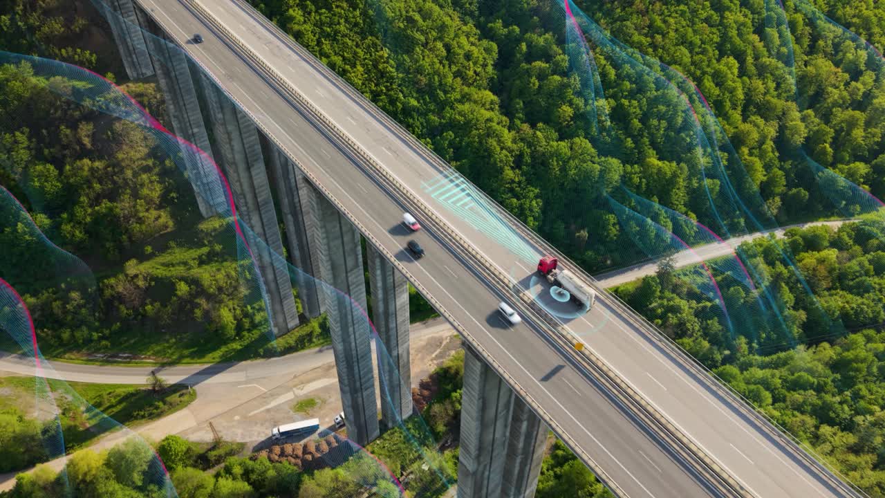 Drone shot following a driverless electric truck on a coastal highway with ocean views. Symbol of innovation, automation, and sustainable freight transport. Great for projects about modern logistics