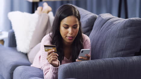 woman shopping online on her couch