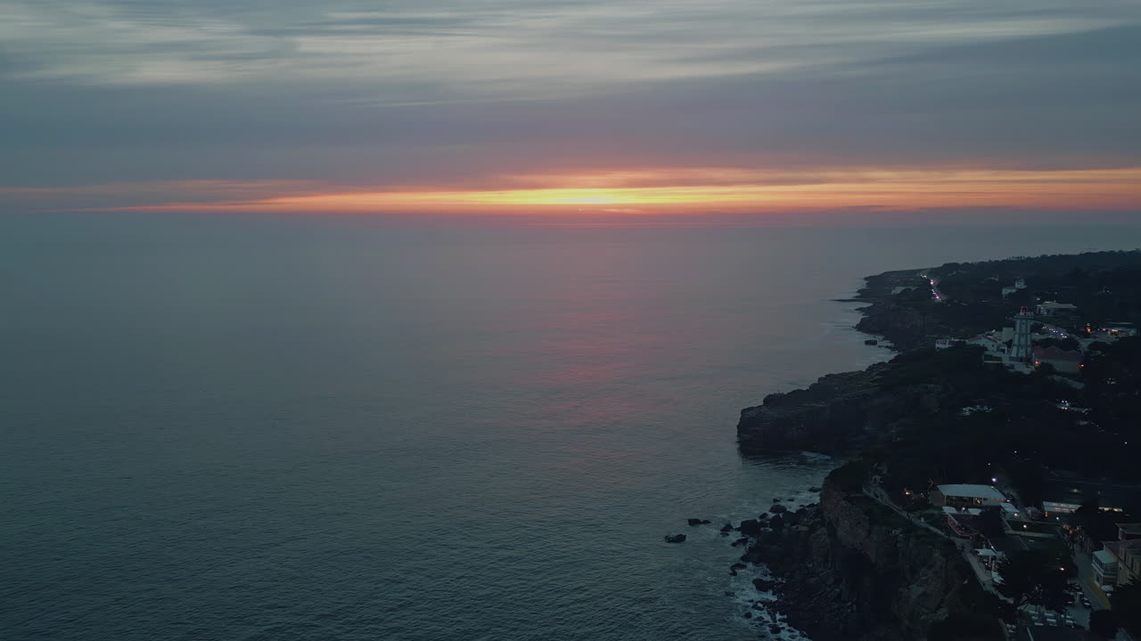 Peaceful ocean evening dusk with cloudy sky over endless horizon aerial view
