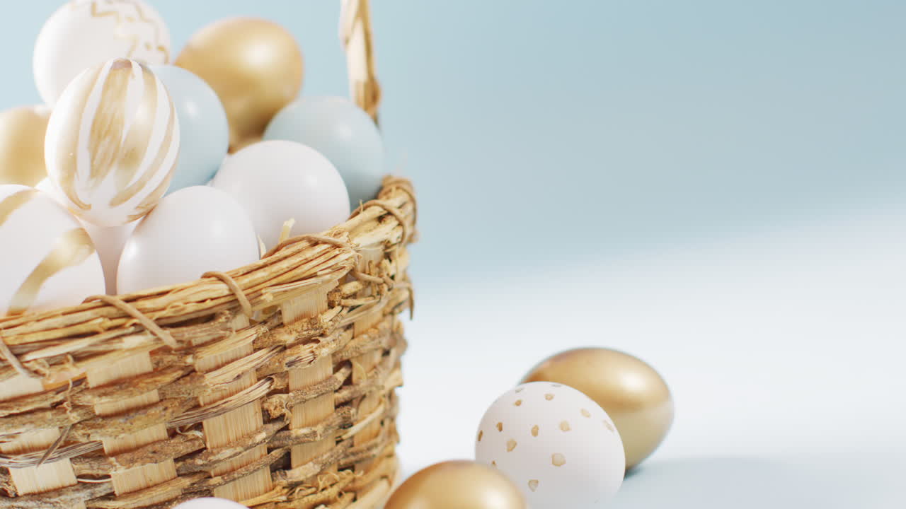 Basket with colorful easter eggs on blue background with copy space
