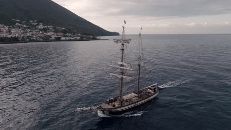 Sail boat entering port Aeolian Islands Italy