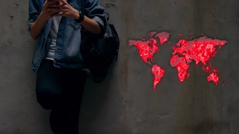 World-map-against-mid-section-of-man-using-smartphone