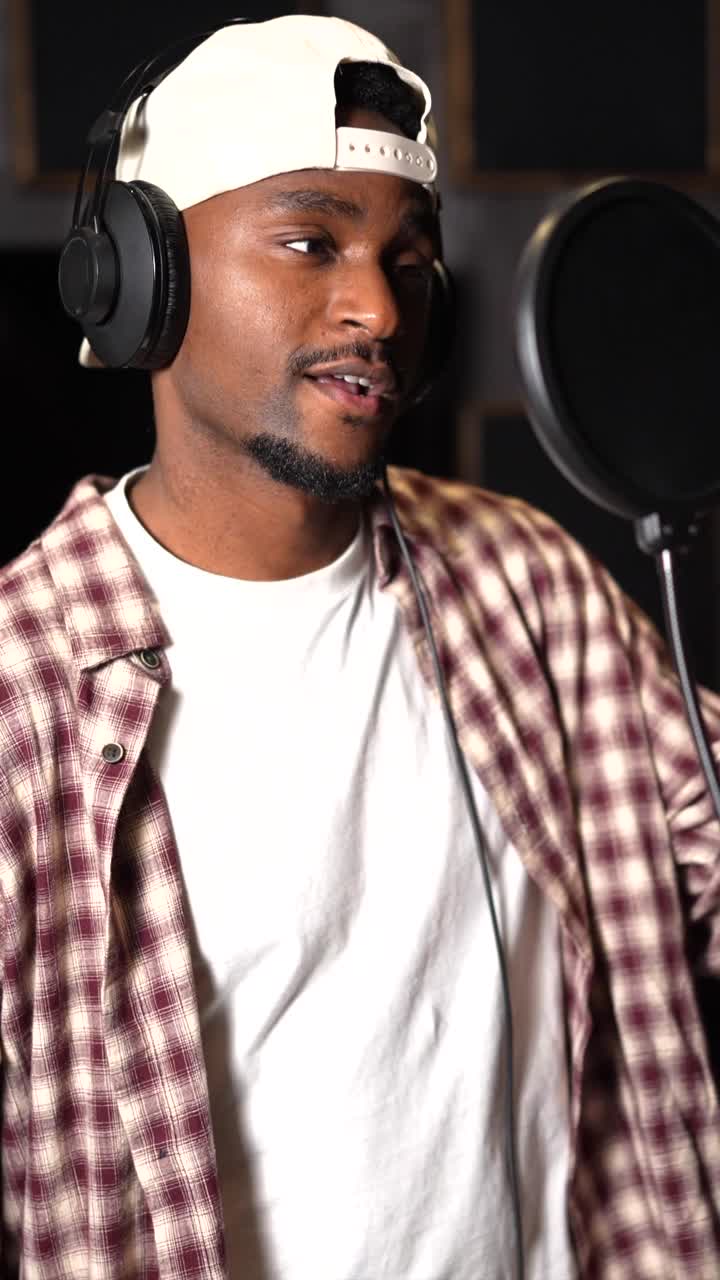 Man singing in a recording studio