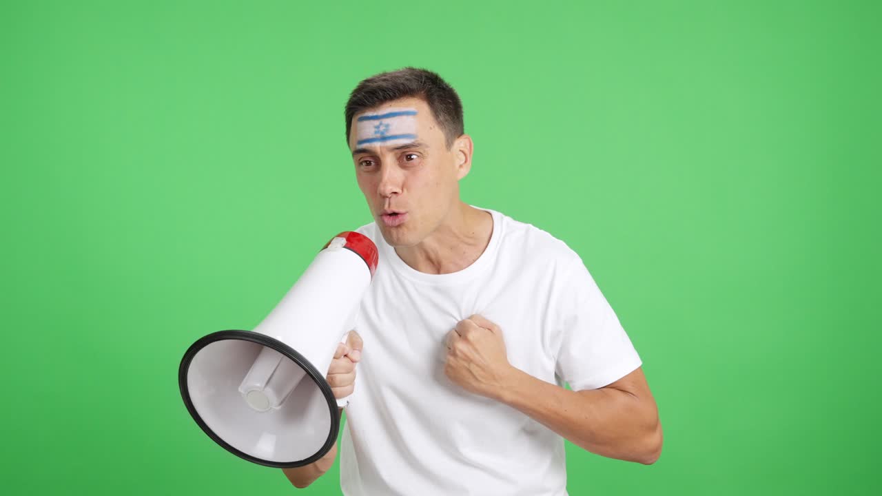Excited man with israeli flag on face using a megaphone