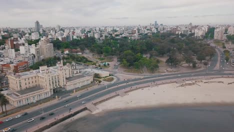 panoramic aerial footage revealing coastline landscape of parque rodo and playa rami­rez, showcasing urban scenery and natural beauty of montevideo's coastal district