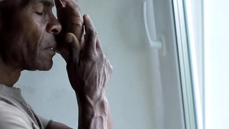 man praying to god with hands together caribbean man praying with background with people stock video stock footage