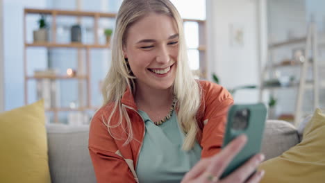 Woman,-smartphone-typing-and-laugh-on-sofa