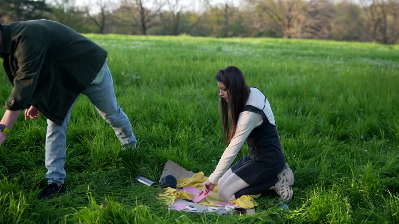 Friends playing cards in the park