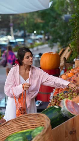 woman shopping at a fruit market