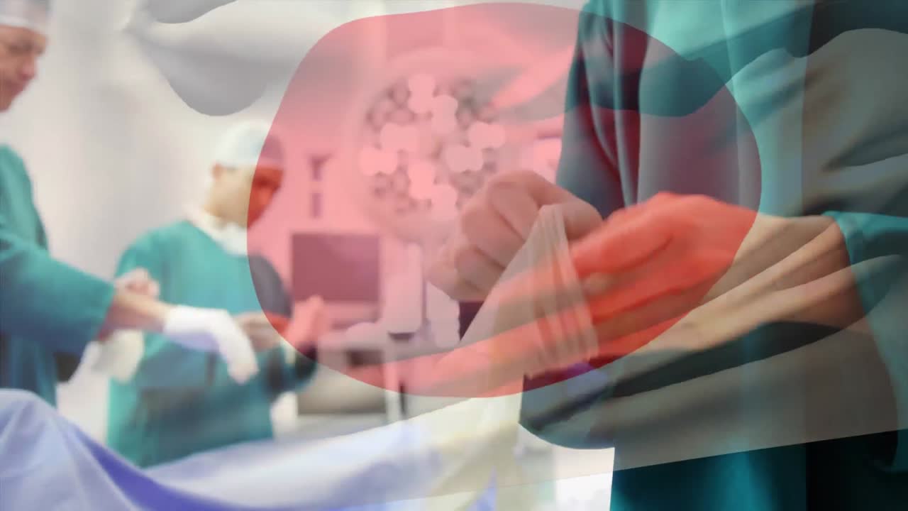 수술실 에서 외과 의사 들 위 에 흔들리는 일본 국기 의 애니메이션