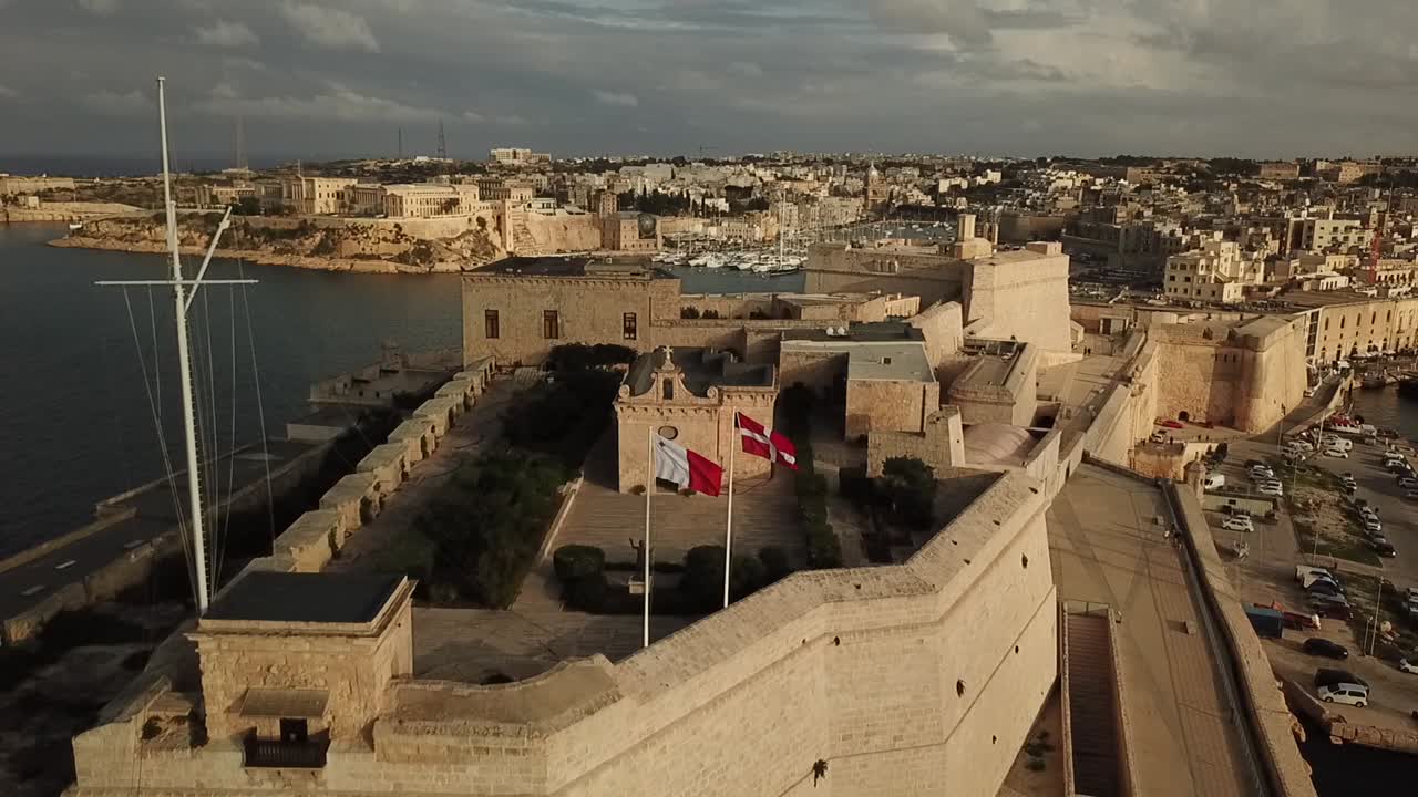 Aerial view of fort St. Angelo in the grand harbour of Malta, Europe. Dolly shot reveailng the front side of the fort.