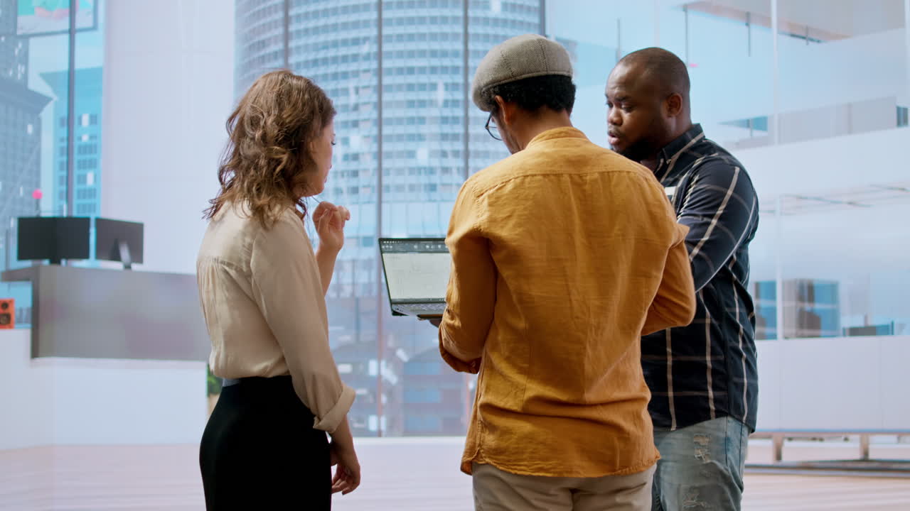 Business development team reviewing architectural plans for a high class office