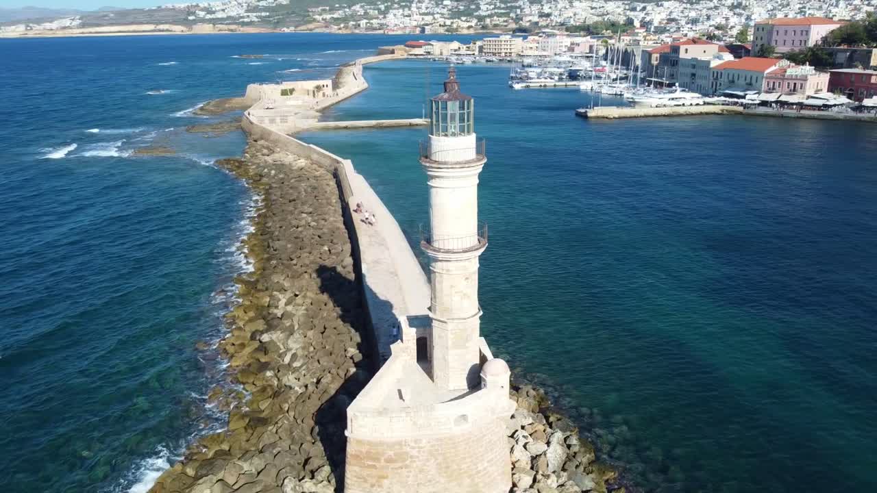 Lighthouse On The Port Of Chania Over The Island of Crete, Greece. Aerial Drone Shot