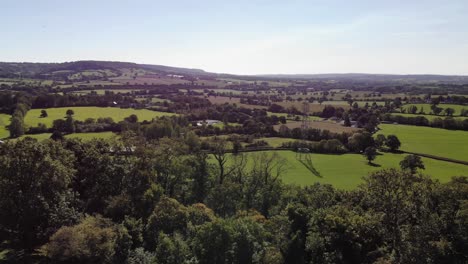 aerial over idyllic east devon countryside near honiton.  pedestal down