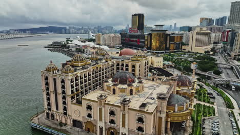 an aerial view of a city with a large body of water