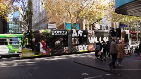 pedestrians and tram in melbourne city street