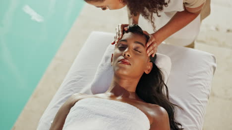 woman receiving a facial massage at a spa