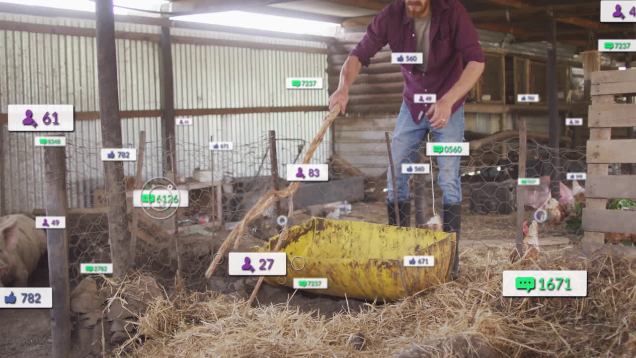 male farmer using shovel in poultry barn adding motion social media marketing icons swirling around