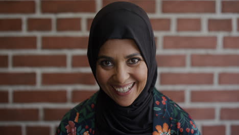 portrait beautiful middle aged muslim woman laughing enjoying happy independent lifestyle wearing tradition hijab headscarf slow motion ethnic beauty