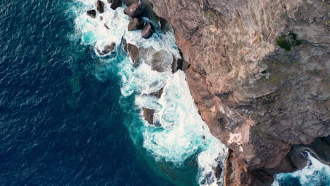 Aerial-shot-of-ocean-coast-with-views-of-waves-and-cliffs