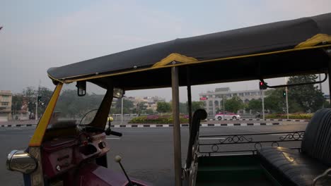 A-Tuk-tuk-parked-at-the-Giant-Swing,-Bangkok,-Thailand