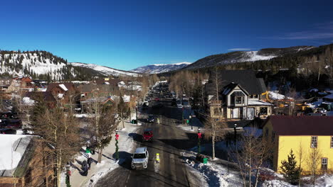 aerial of street and houses covered with snow in the georgetown of colorado