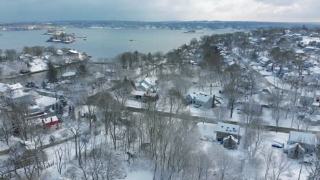 drone crane up shot of hingham, ma after a snowstorm