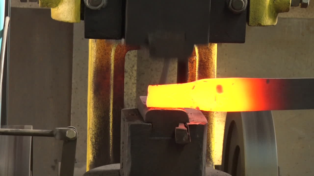 The Machine Automatically Hits The Hot Iron
