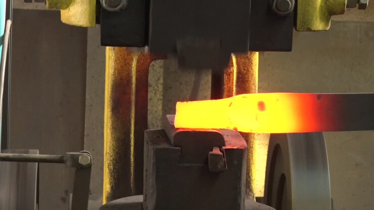 The Machine Automatically Hits The Hot Iron
