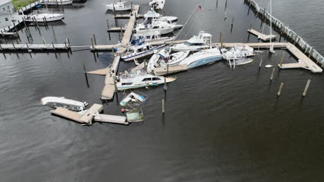 damaged marina and sunken boats post hurricane ian