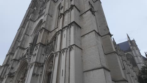 front facing view of st. michael and st. gudula cathedral, highlighting its grand gothic architecture in brussels, establishing tilt