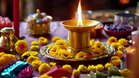 hindu religious offering with diya and flowers