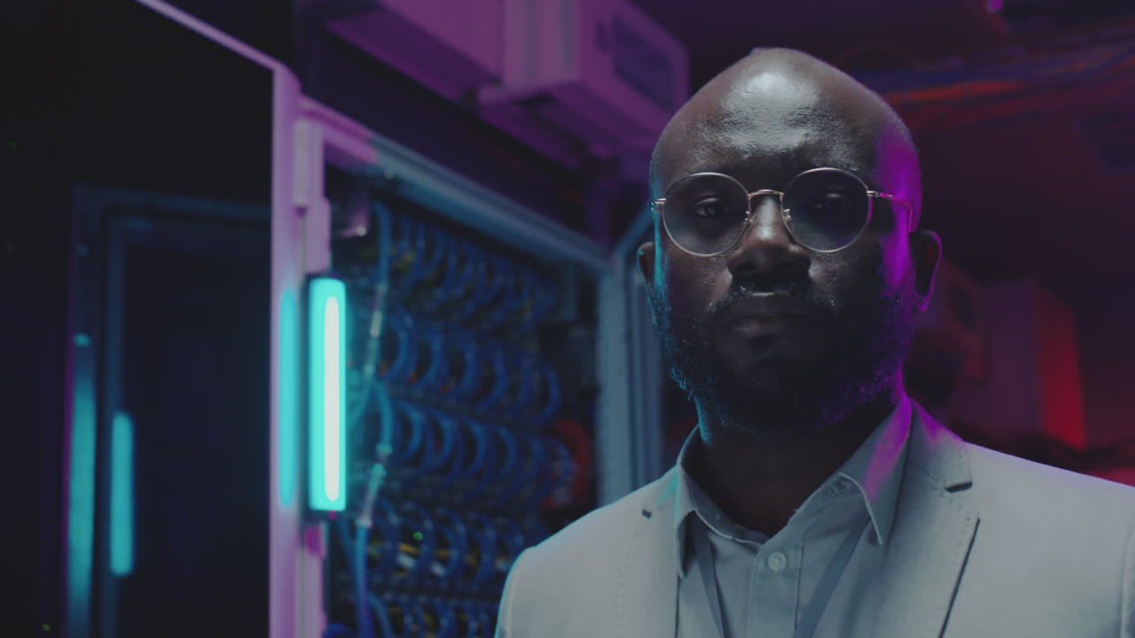 IT Professional in a Data Center with Neon Lights