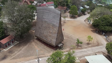 aerial drone footage along a traditional wooden house from bahnar minory in central highland vietnam. kon tum province