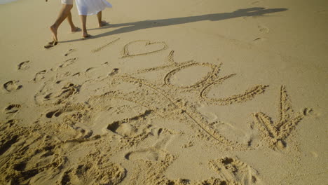 i love you inscription on sand