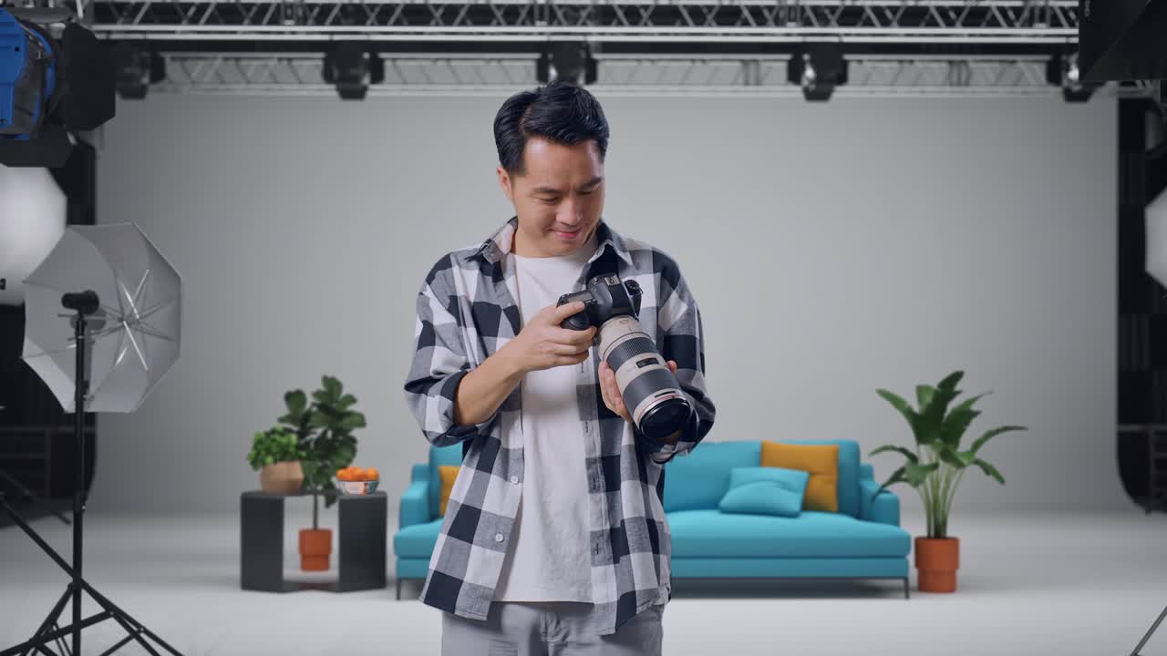 Photographer Checking Camera in Studio