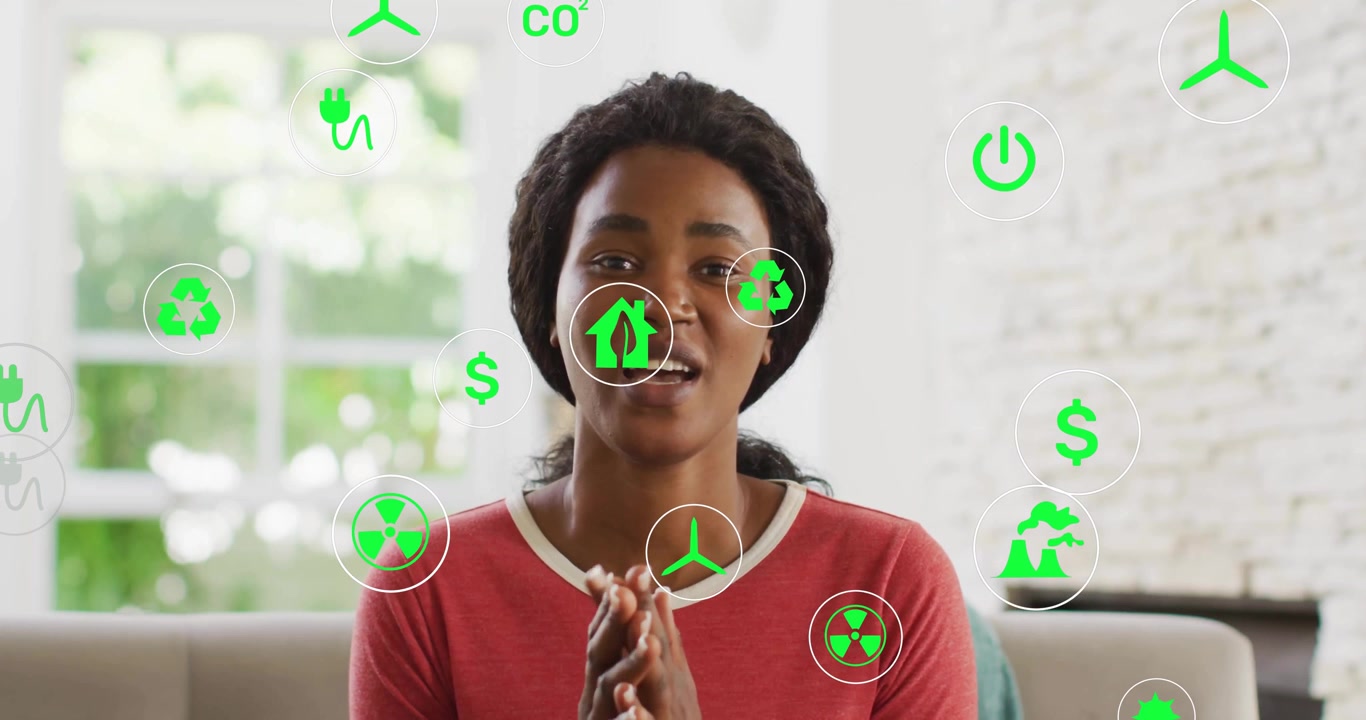 Donna che inizia un discorso, lanciando icone ecologiche animate intorno alla sua testa che illustrano i collegamenti dei costi energetici