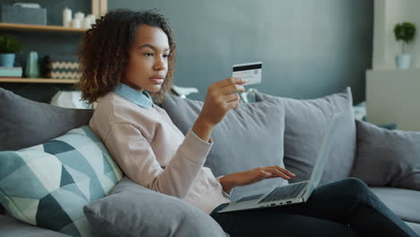 woman paying online with credit card