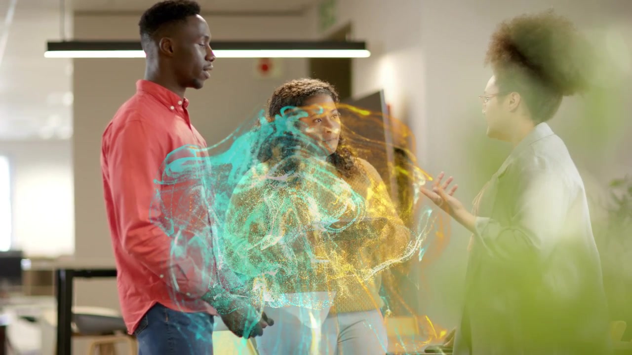 Team talking business with tablet, right woman gesturing, causing teal-gold swirling around group