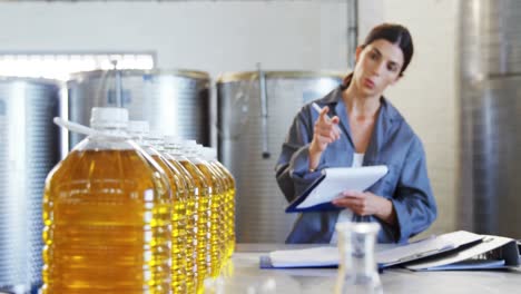 Female-worker-working-in-oil-factory