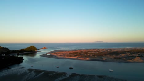 Aerial-view-of-Nature-Reserve-near-Mangawhai-Beach-during-beautiful-sunset-in-New-Zealand