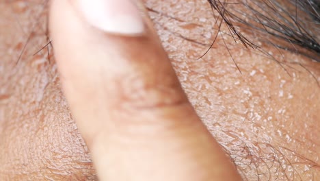 close-up of sweat drops on forehead