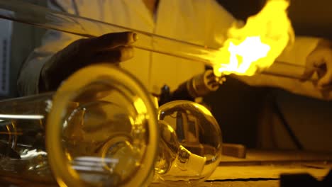 close-up of male worker creating glass in glass factory 4k