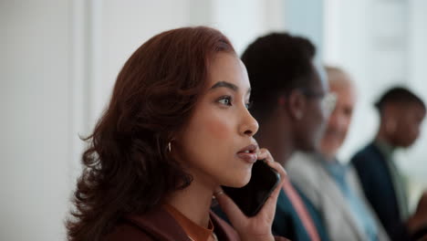 businesswoman on a phone call in a waiting room
