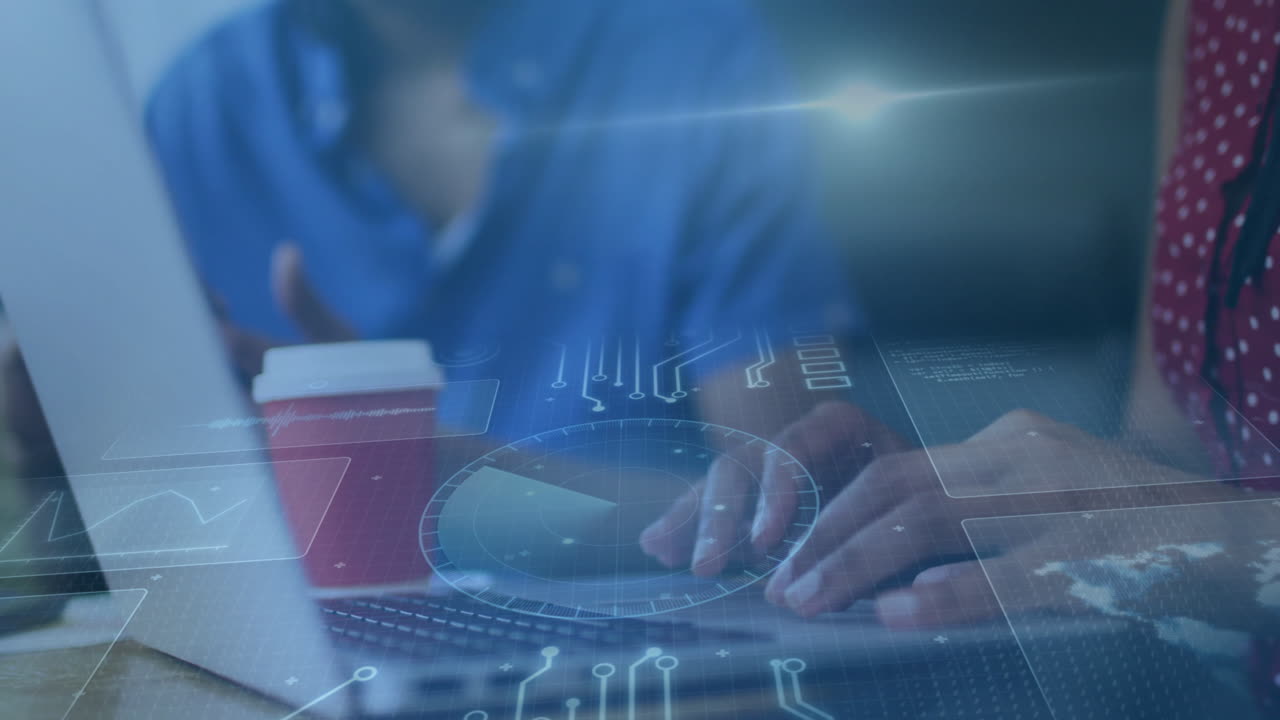 Typing on laptop, hands interacting with digital animation interface in office