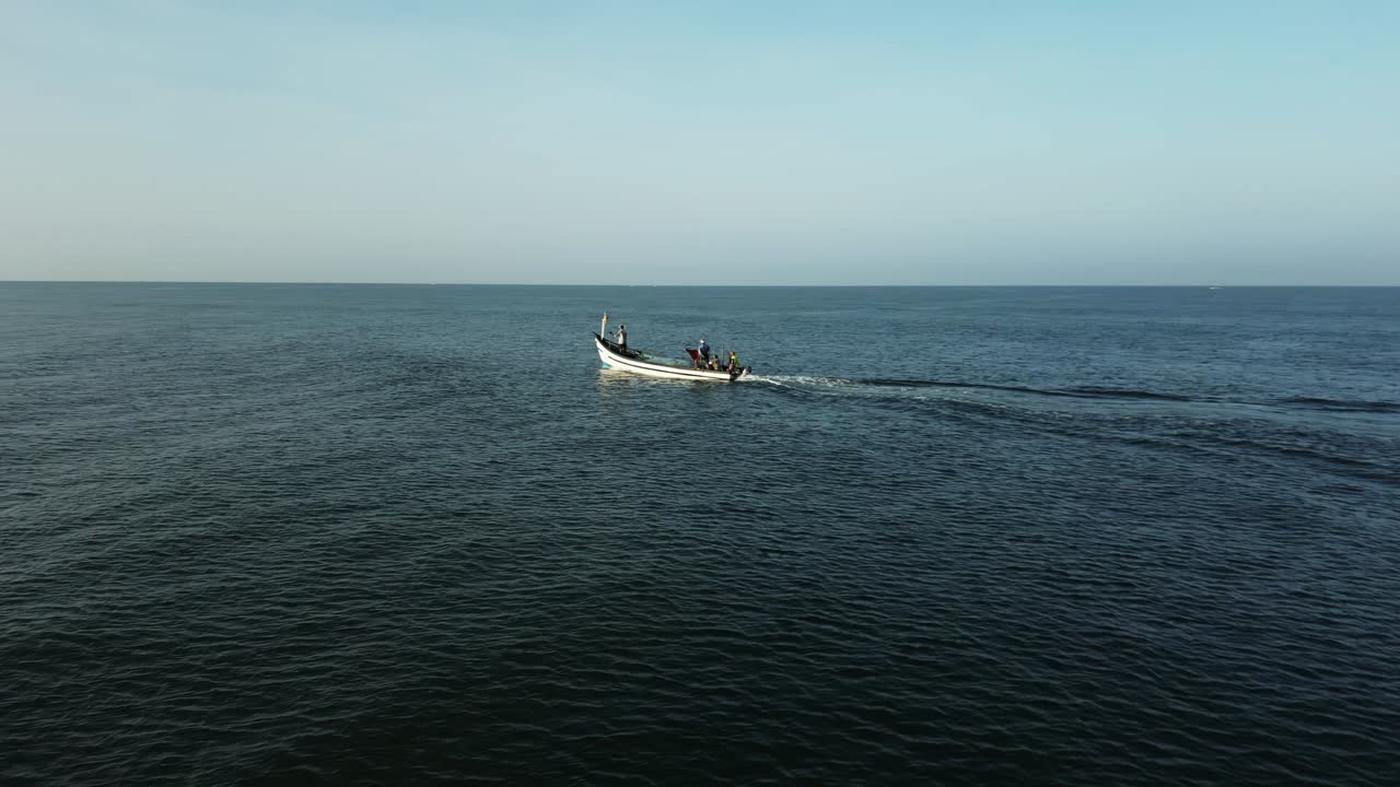Fisher men on their dungi going for work in the morning in Goa, India