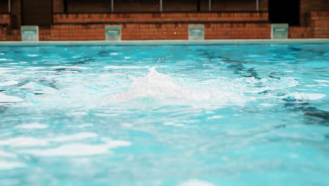 senior man swimming in pool