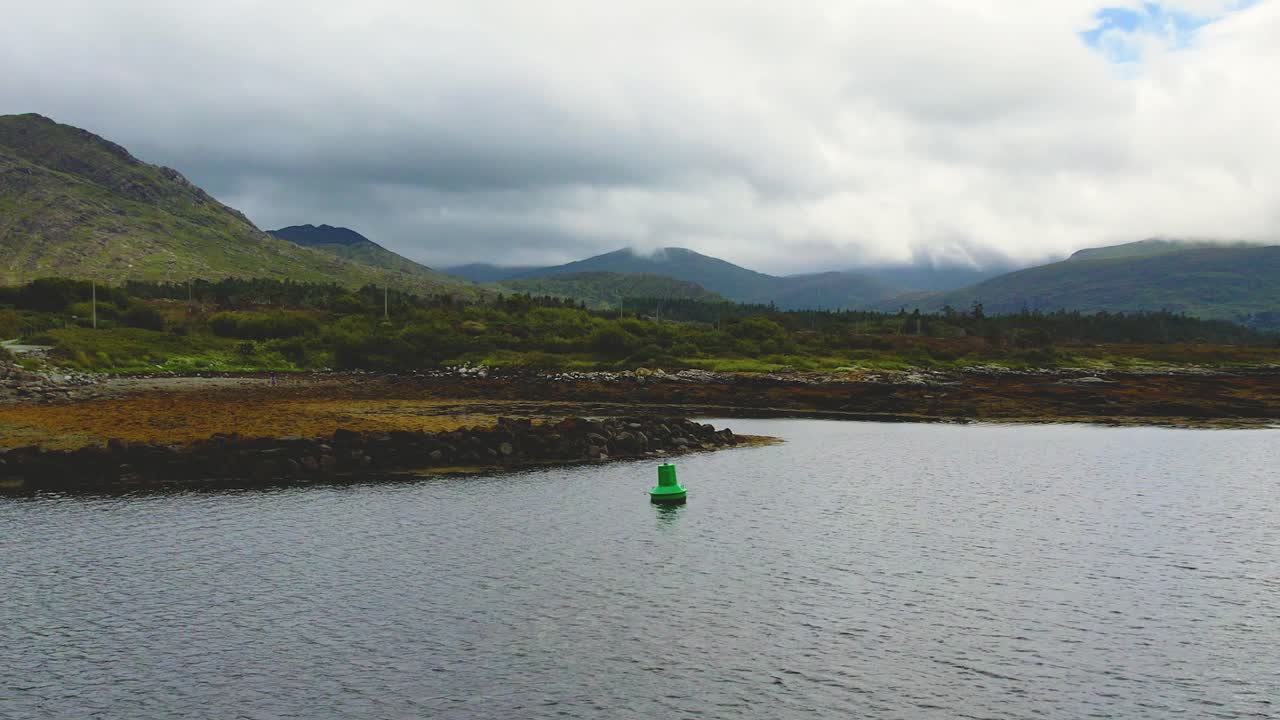 A 4K drone rising forward shot of Kilmackillogue and Mount Knockatee looking east towards Glengarrriff Co Kerry Ireland near Helen's Bar