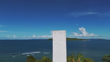 Aerial-Drone-View-Flying-Over-White-Cross-in-Old-Catholic-Cemetery-in-Surigao-Del-Norte,-Philippines