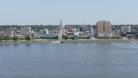 downtown davenport, iowa skyline and mississippi river with drone video moving left to right